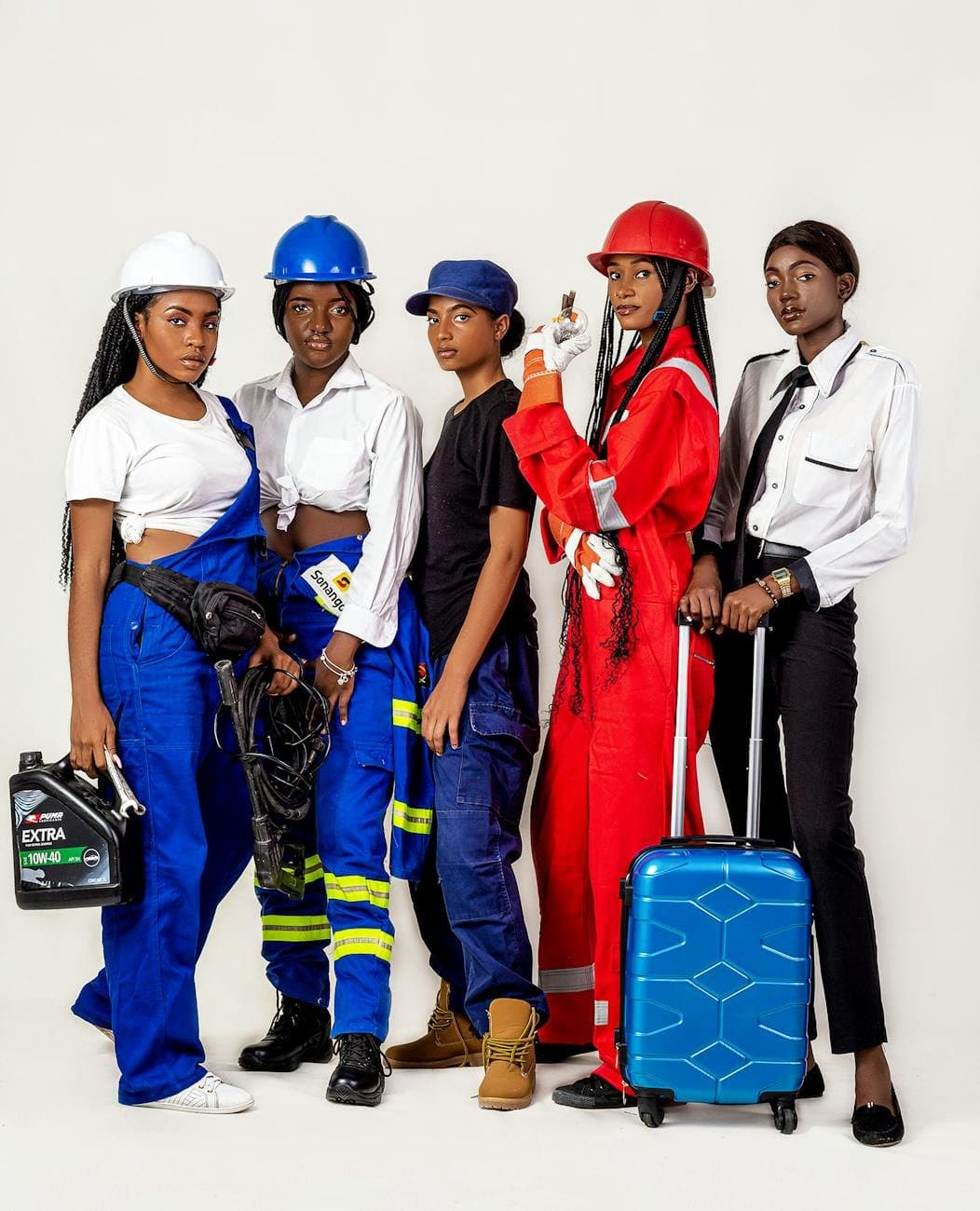 diverse group of workers in various uniforms (Pexels)